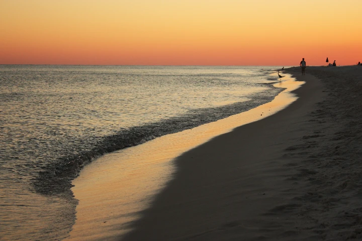 A real sunset beach photograph with camera metadata